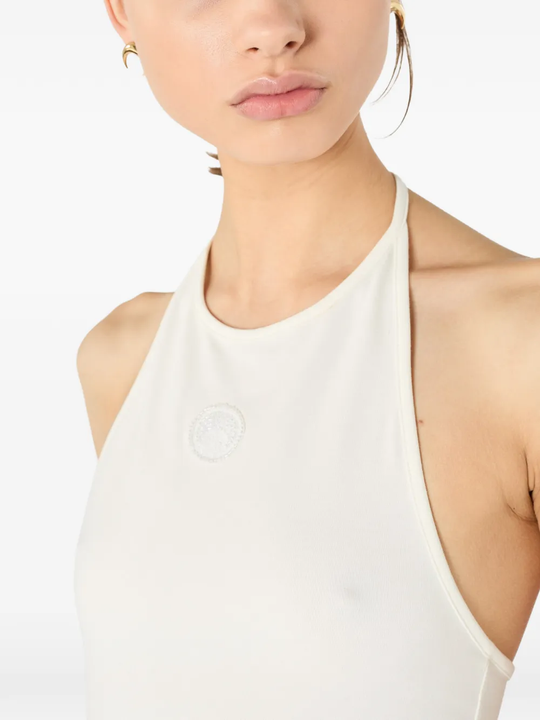 Close up of white tops, showing texture of the cotton fabric