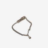 Close up of grey small accessories, showing texture of the brass fabric