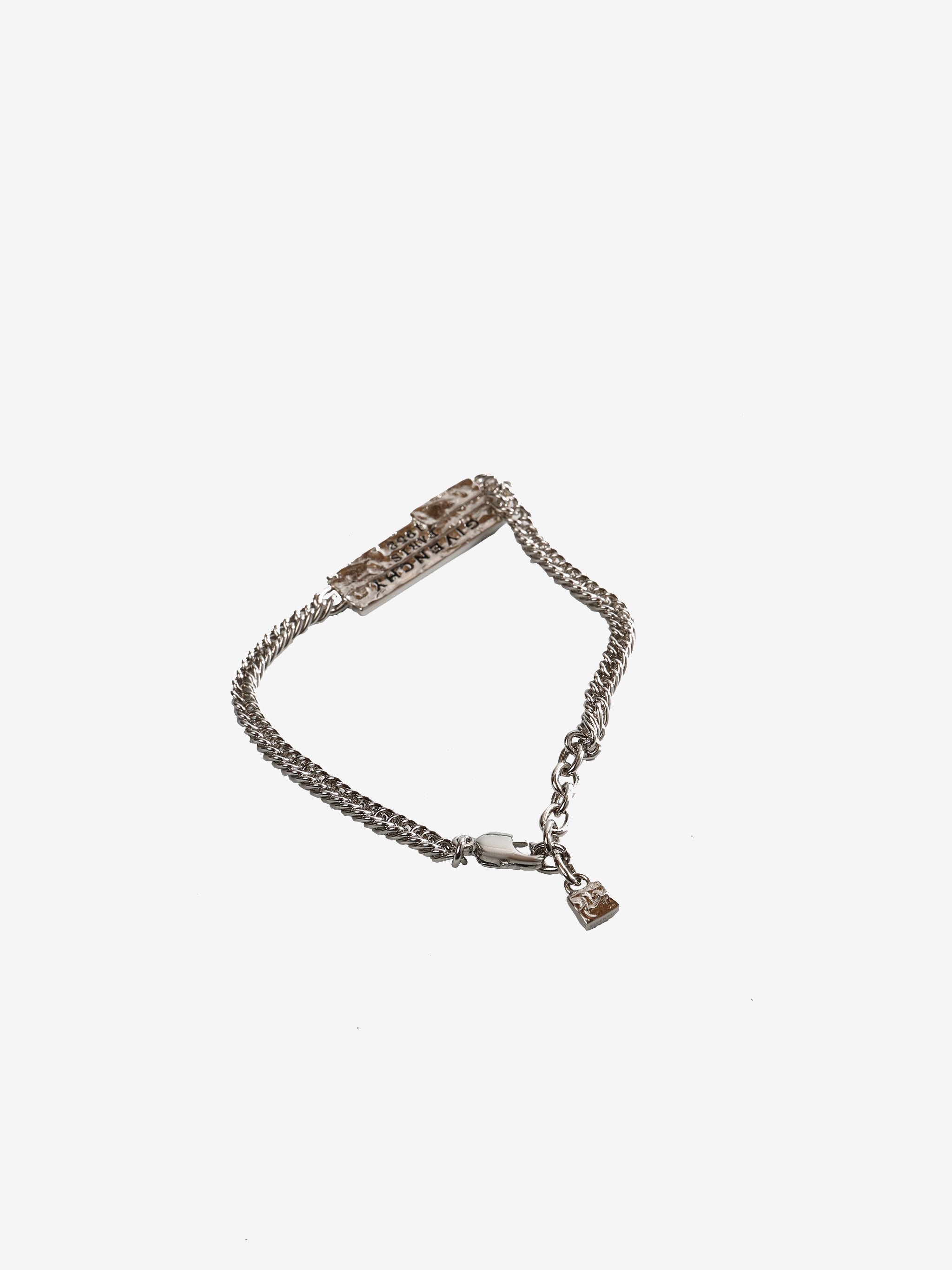 Close up of grey small accessories, showing texture of the brass fabric