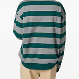 Green t-shirt worn by a person, showing the t-shirt fit