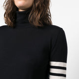 Close up of navy dress, showing texture of the wool-blend fabric