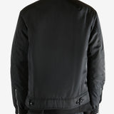 Black jacket worn by a person, showing the jacket's fit