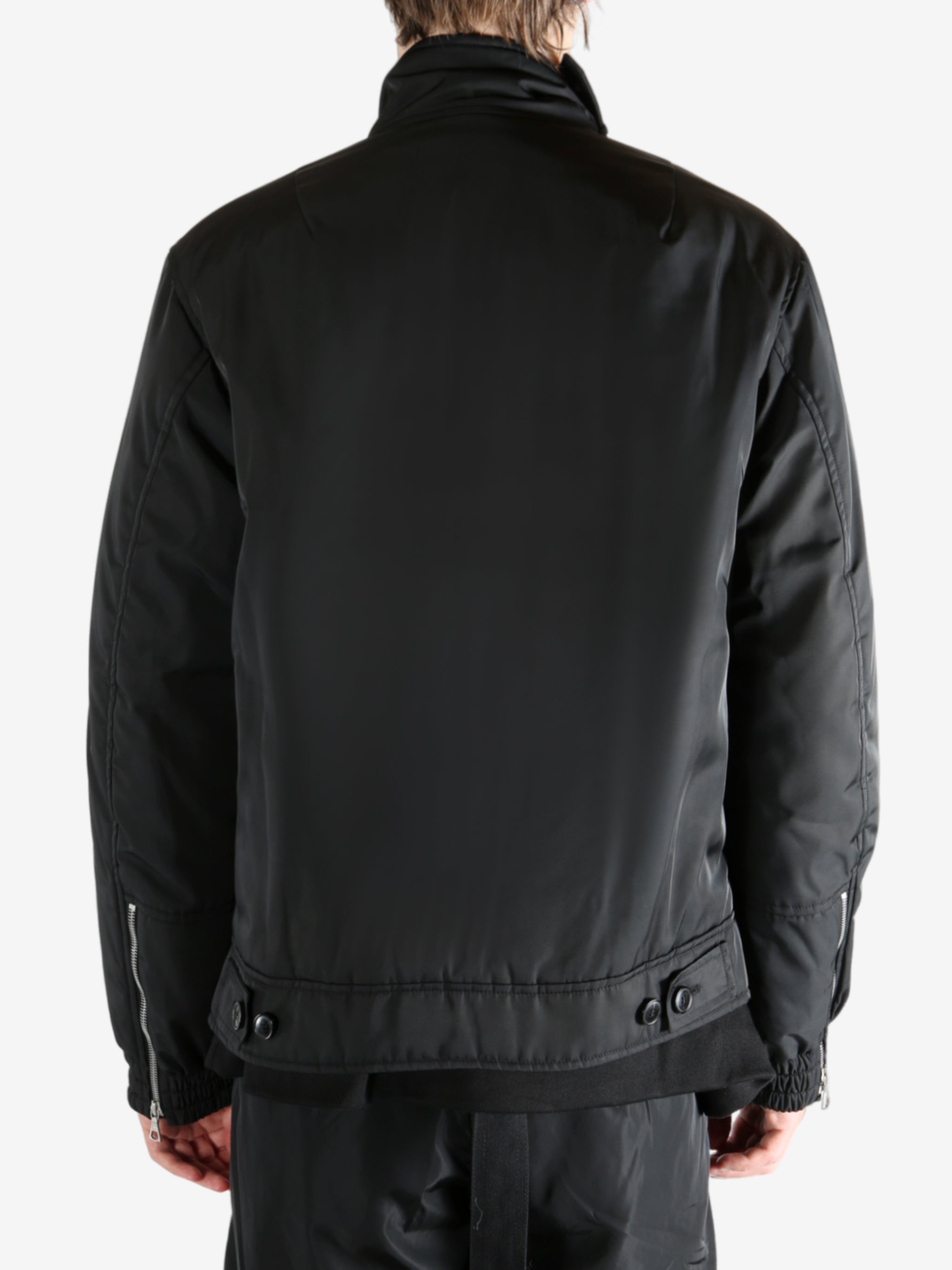 Black jacket worn by a person, showing the jacket's fit