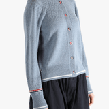 Blue cardigan worn by a person, showing the cardigan's fit