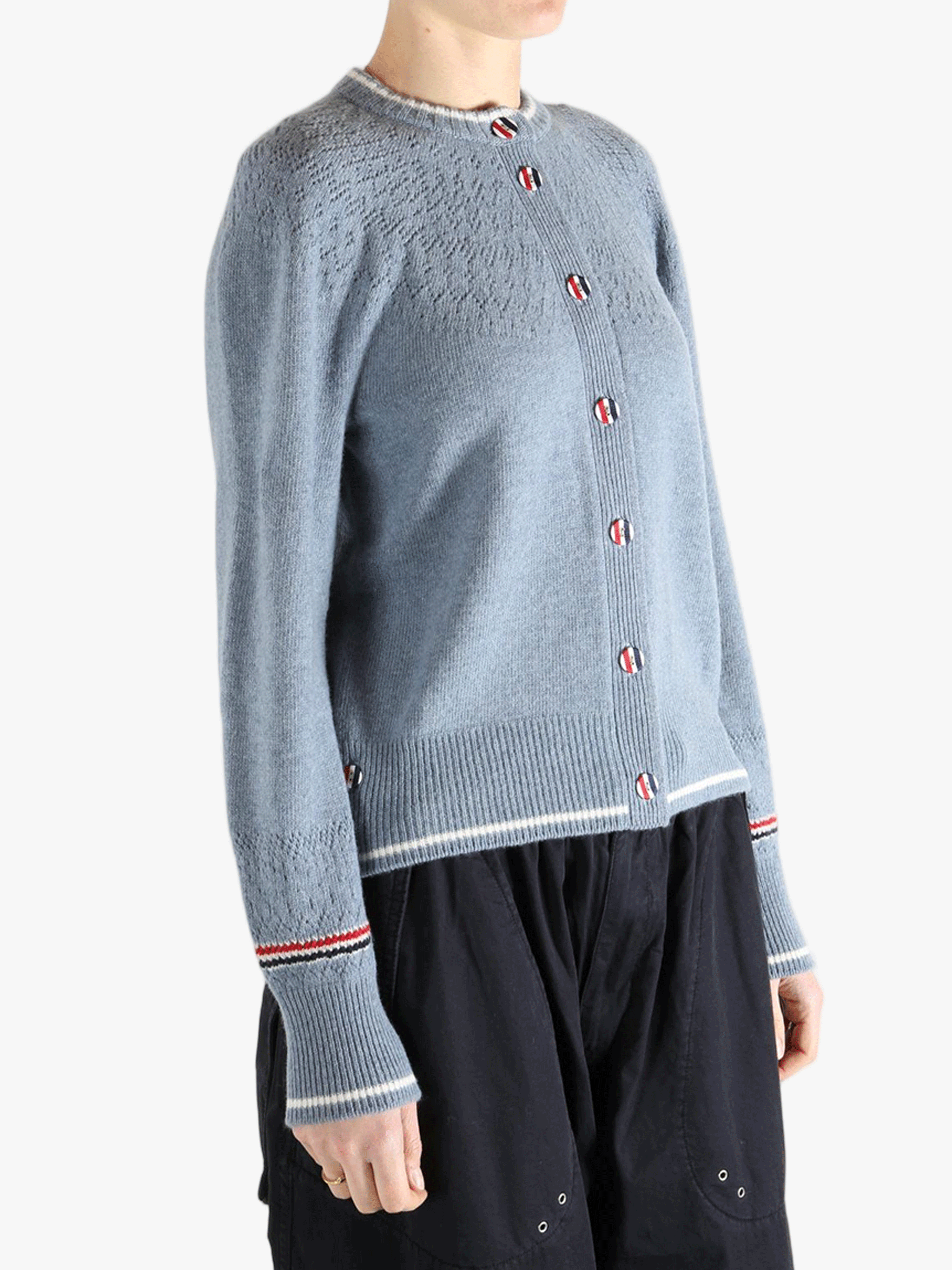 Blue cardigan worn by a person, showing the cardigan's fit