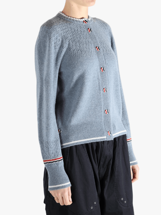 Blue cardigan worn by a person, showing the cardigan's fit