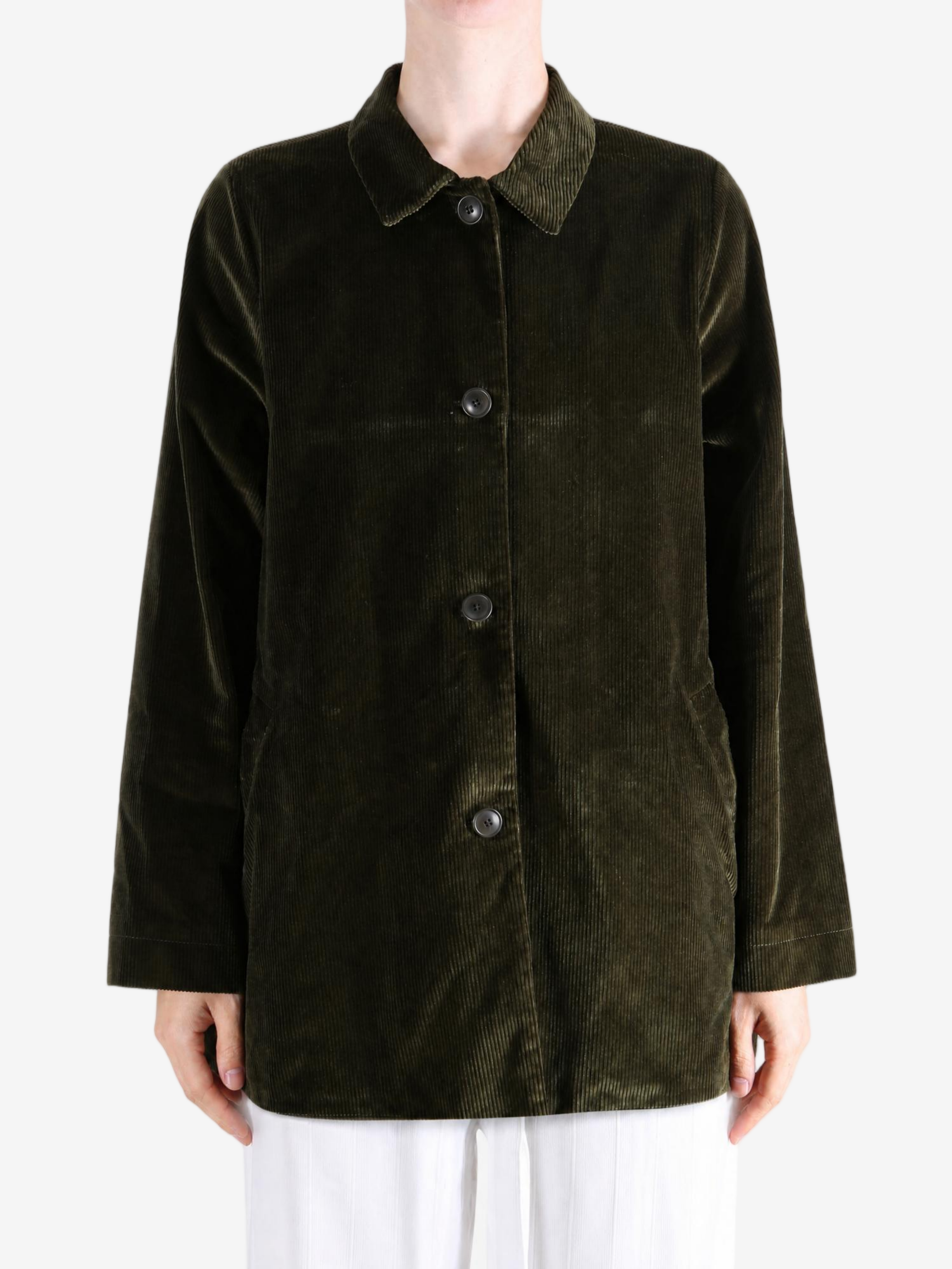 Green jacket worn by a person, showing the jacket fit