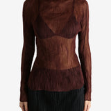 Brown shirt worn by a person, showing the shirt's fit