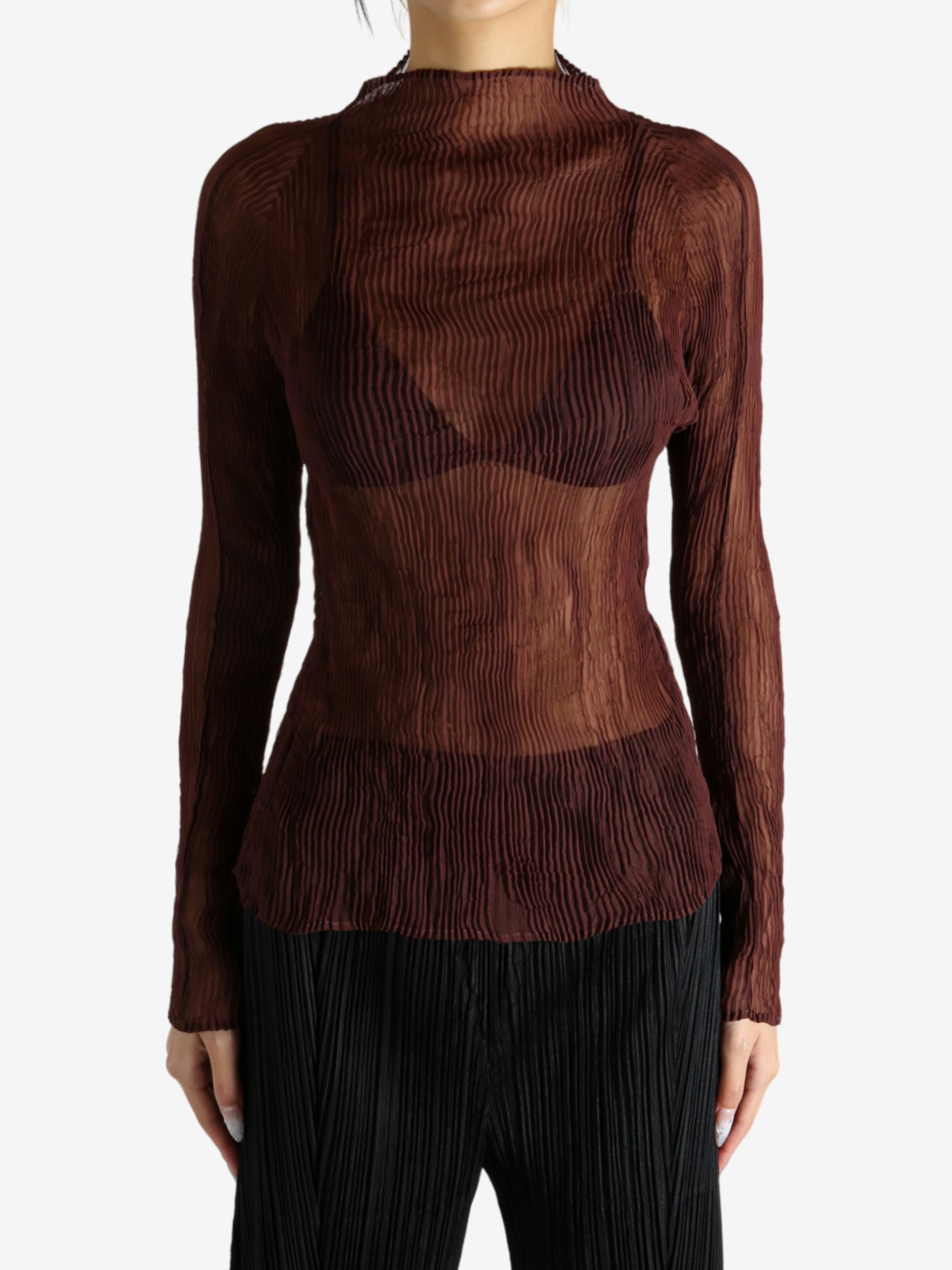 Brown shirt worn by a person, showing the shirt's fit