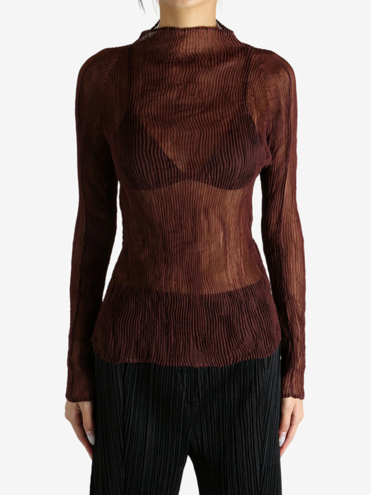 Brown shirt worn by a person, showing the shirt's fit