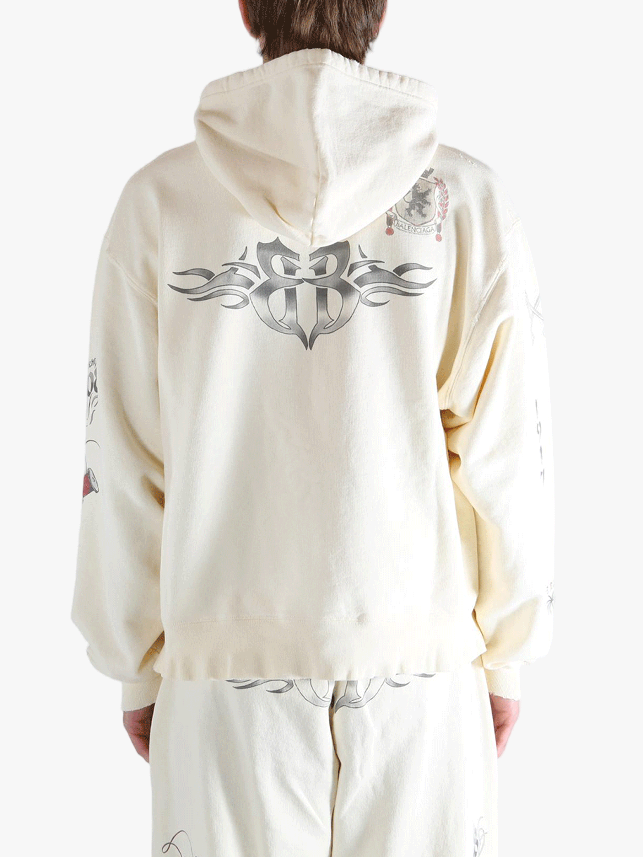 White hoodies worn by a person, showing the hoodies fit