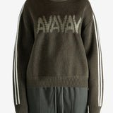 Brown sweater worn by a person, showing the sweater's  fit