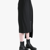 Black skirt worn by a person, showing the skirt fit