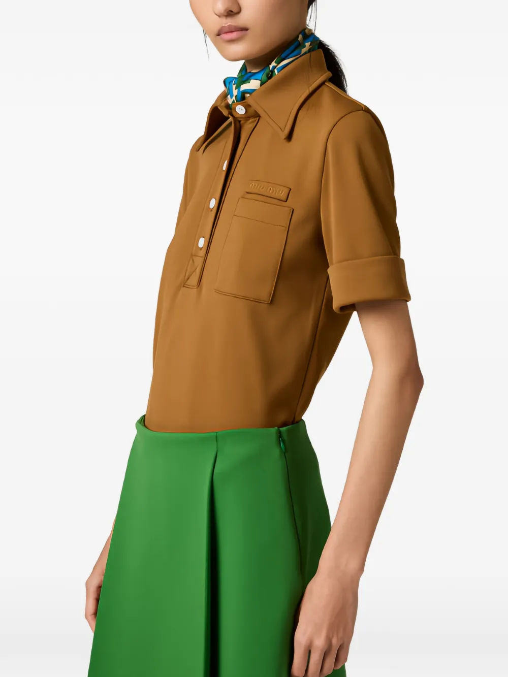 Brown shirt worn by a person, showing the shirt's fit
