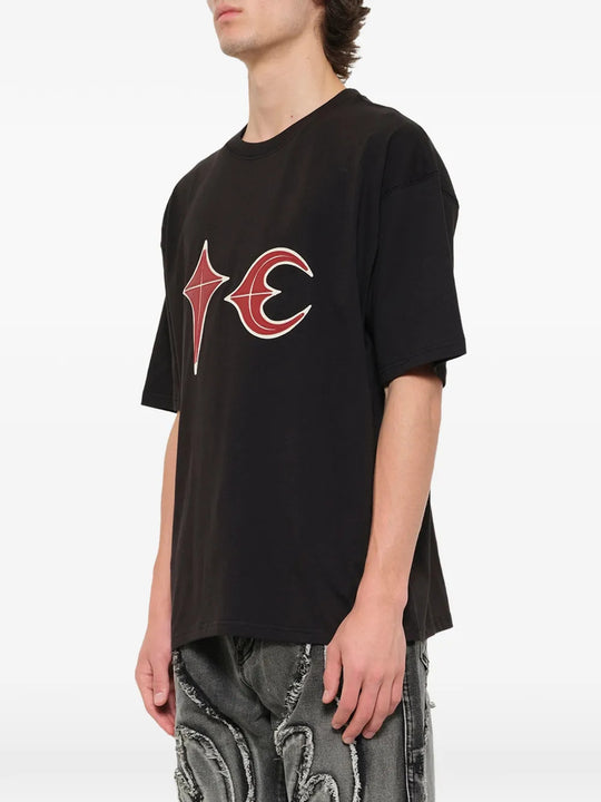 Black t-shirt worn by a person, showing the t-shirt fit