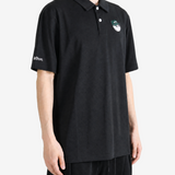 Black shirt worn by a person, showing the shirt fit