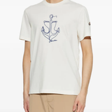 White t-shirt worn by a person, showing the t-shirt's fit