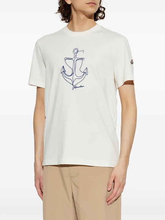 White t-shirt worn by a person, showing the t-shirt's fit