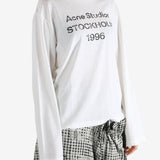 White t-shirt worn by a person, showing the t-shirt fit