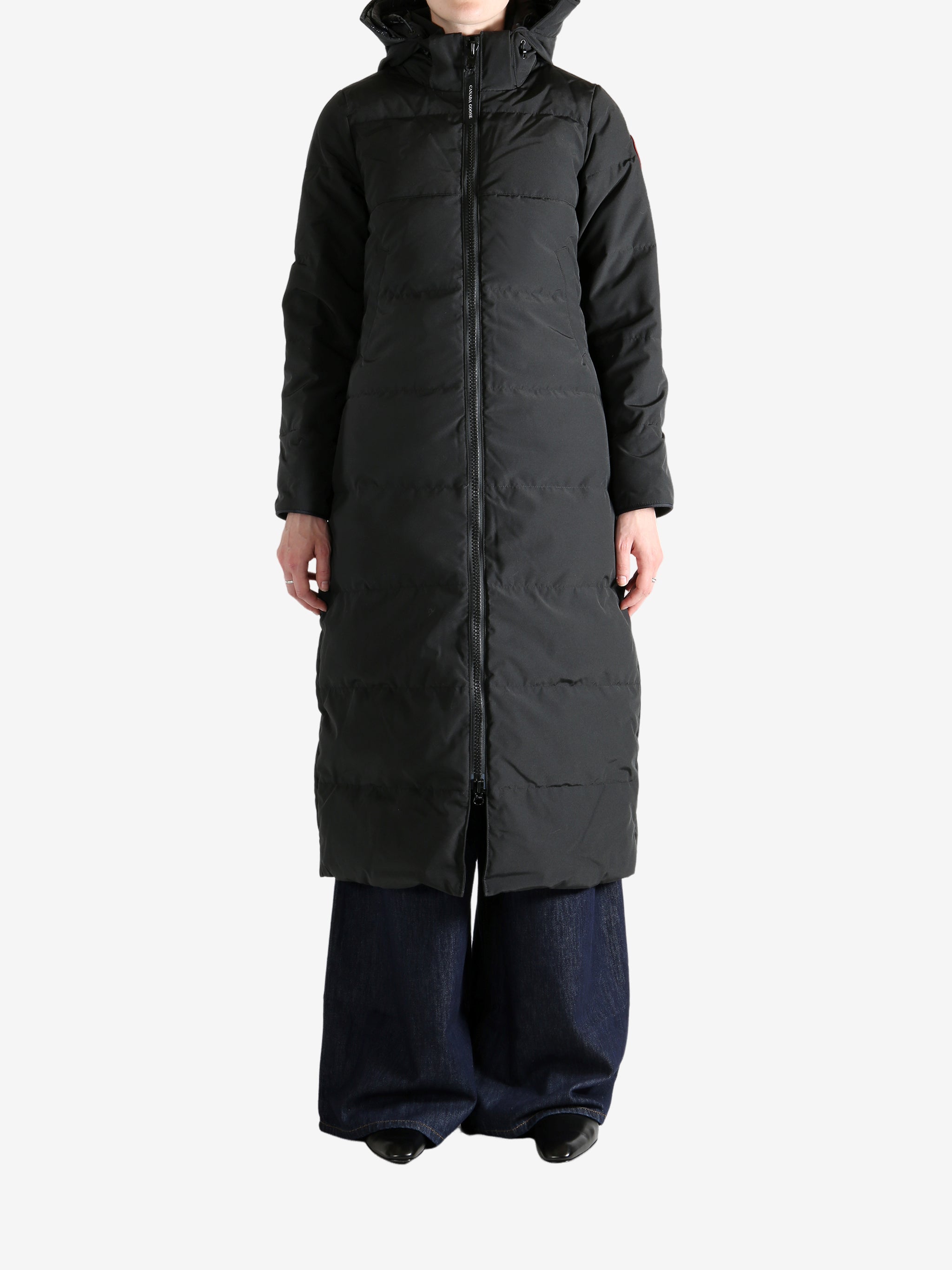 Black jacket worn by a person, showing the jacket's fit