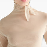 Tan top worn by a person, showing the top fit