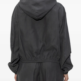 grey hoodie worn by a person, showing the hoodie fit