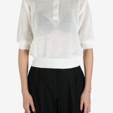 White shirt worn by a person, showing the shirt's fit