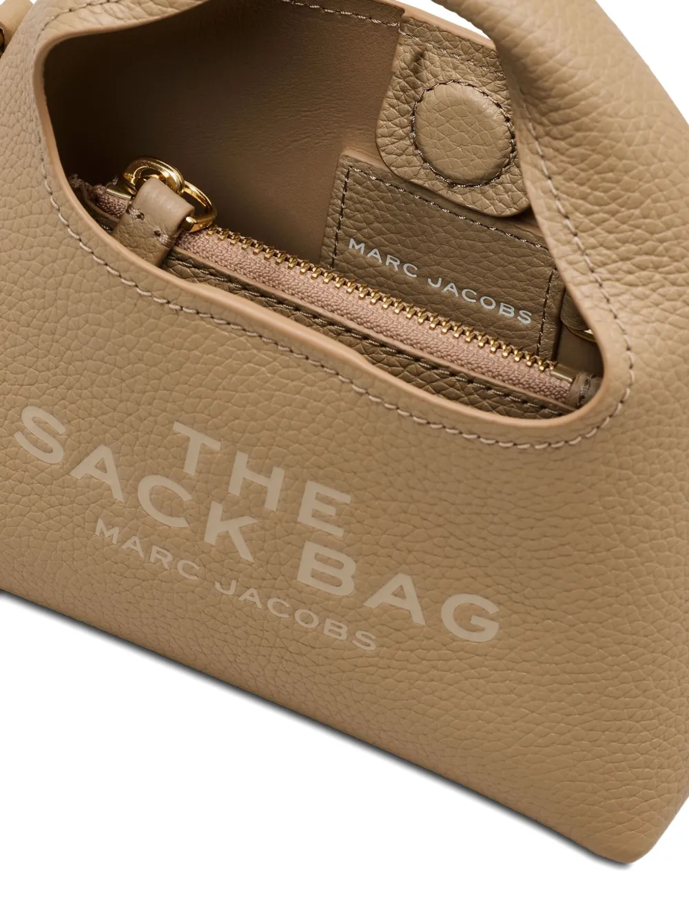 Close up of tan bags,showing texture of the leather fabric