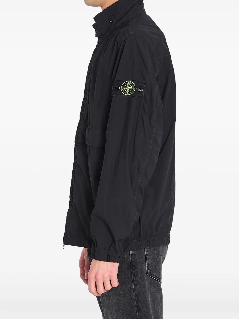 Black jacket worn by a person, showing the black jacket's fit