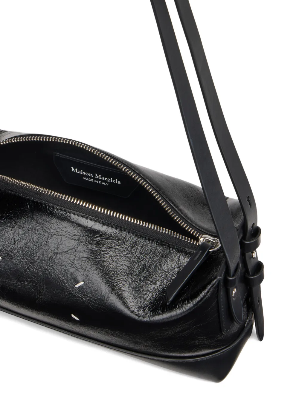 close up of black bags, showing texture of the leather fabric