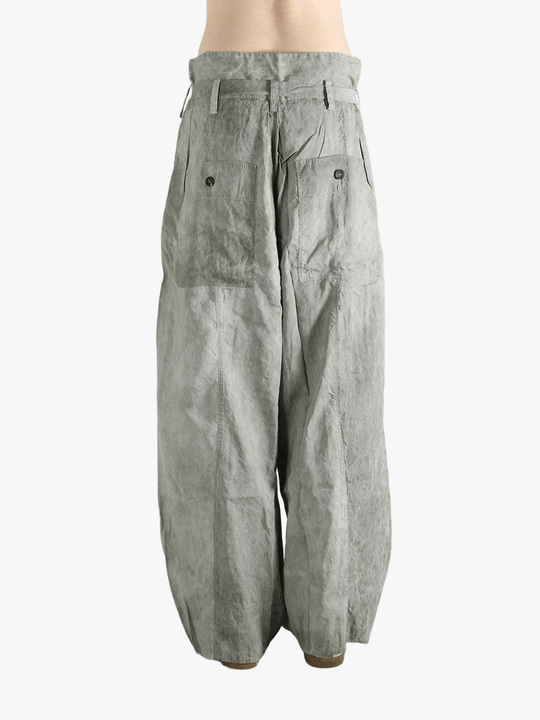 Gray wide-leg pants worn by a person, showing the pants fit