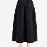 Black skirt worn by a person, showing the skirt fit