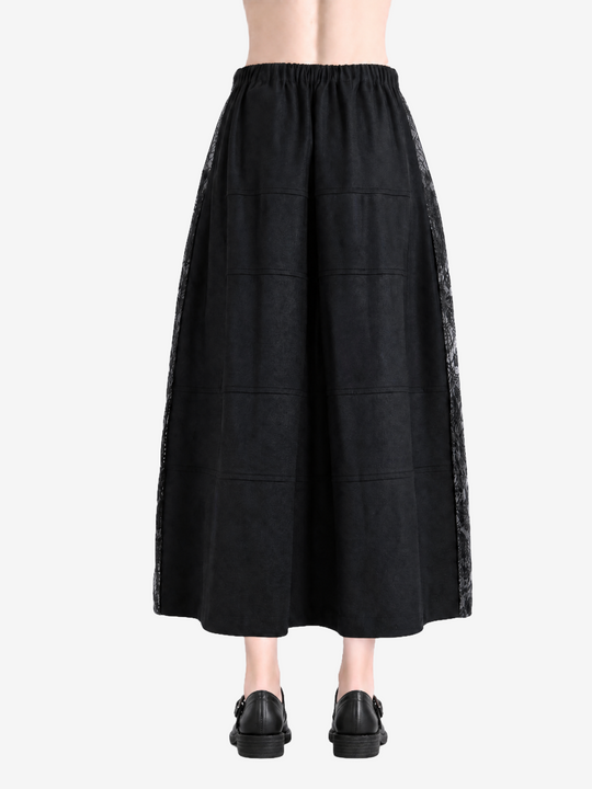 Black skirt worn by a person, showing the skirt fit