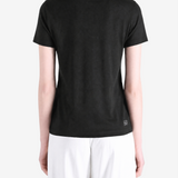 Black t-shirt worn by a person, showing the t-shirt fit