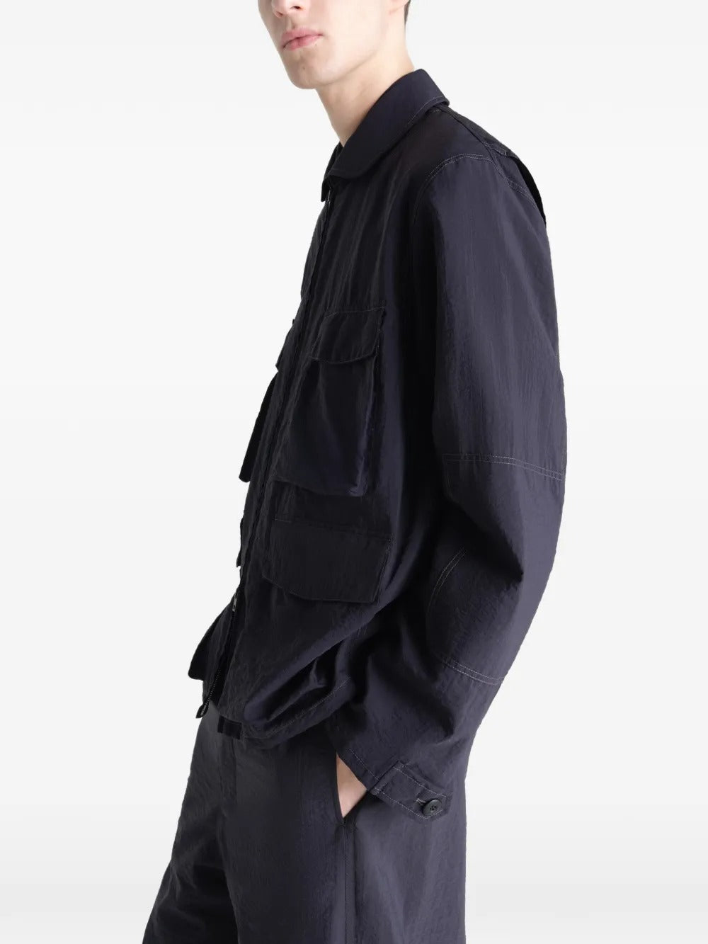 Black jacket worn by a person, showing the jacket's fit