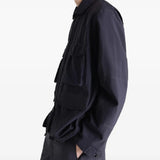 Black jacket worn by a person, showing the jacket's fit