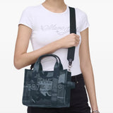 Blue bag worn by a person, showing the bag's fit