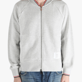 Grey jacket worn by a person, showing the jacket fit