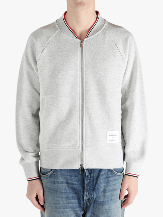 Grey jacket worn by a person, showing the jacket fit