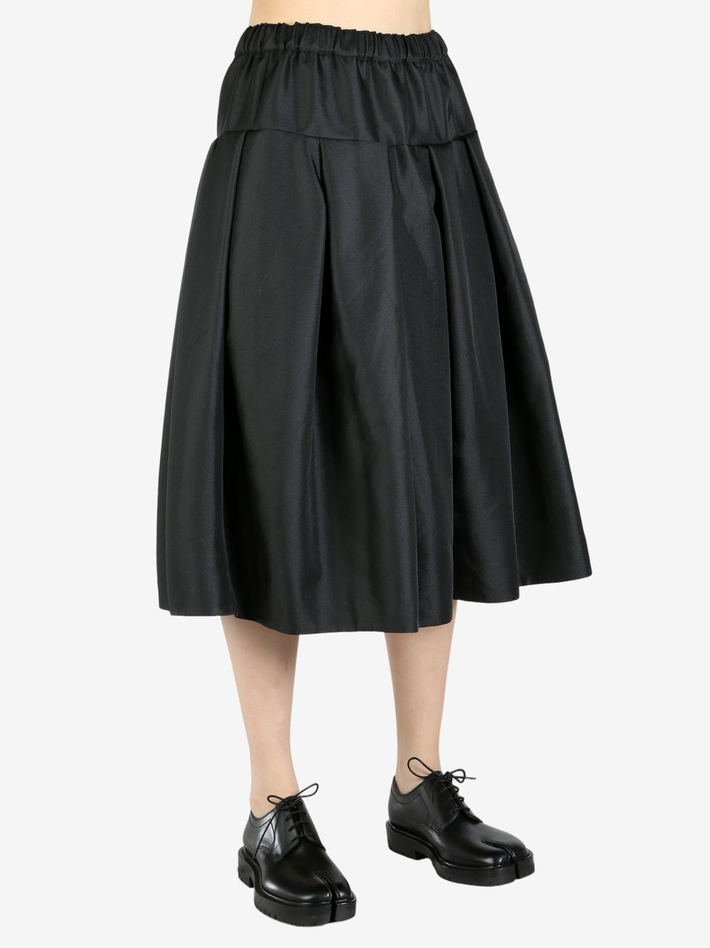 Black skirt worn by a person, showing the skirt's fit