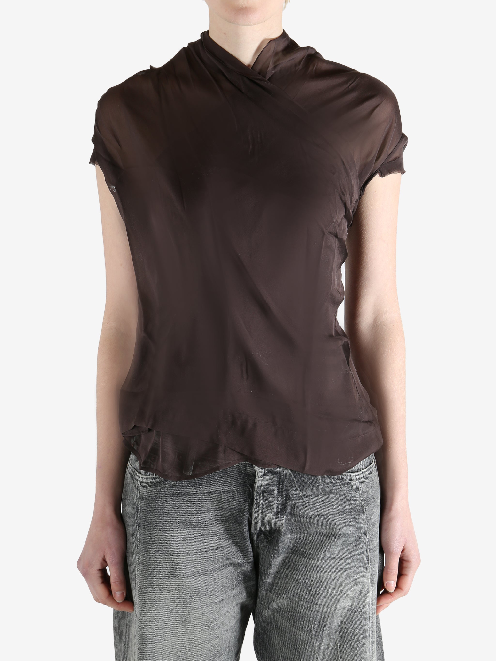 brown top worn by a person, showing the top fit