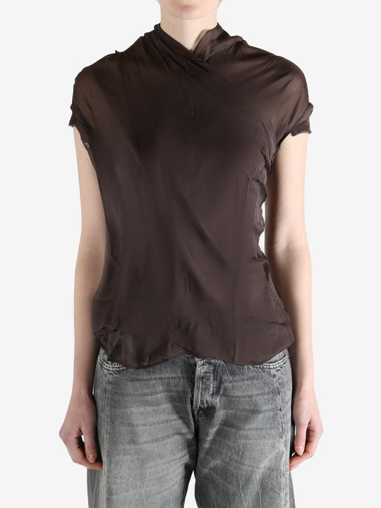 brown top worn by a person, showing the top fit