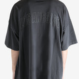 Black t-shirt worn by a person, showing the shirt's fit