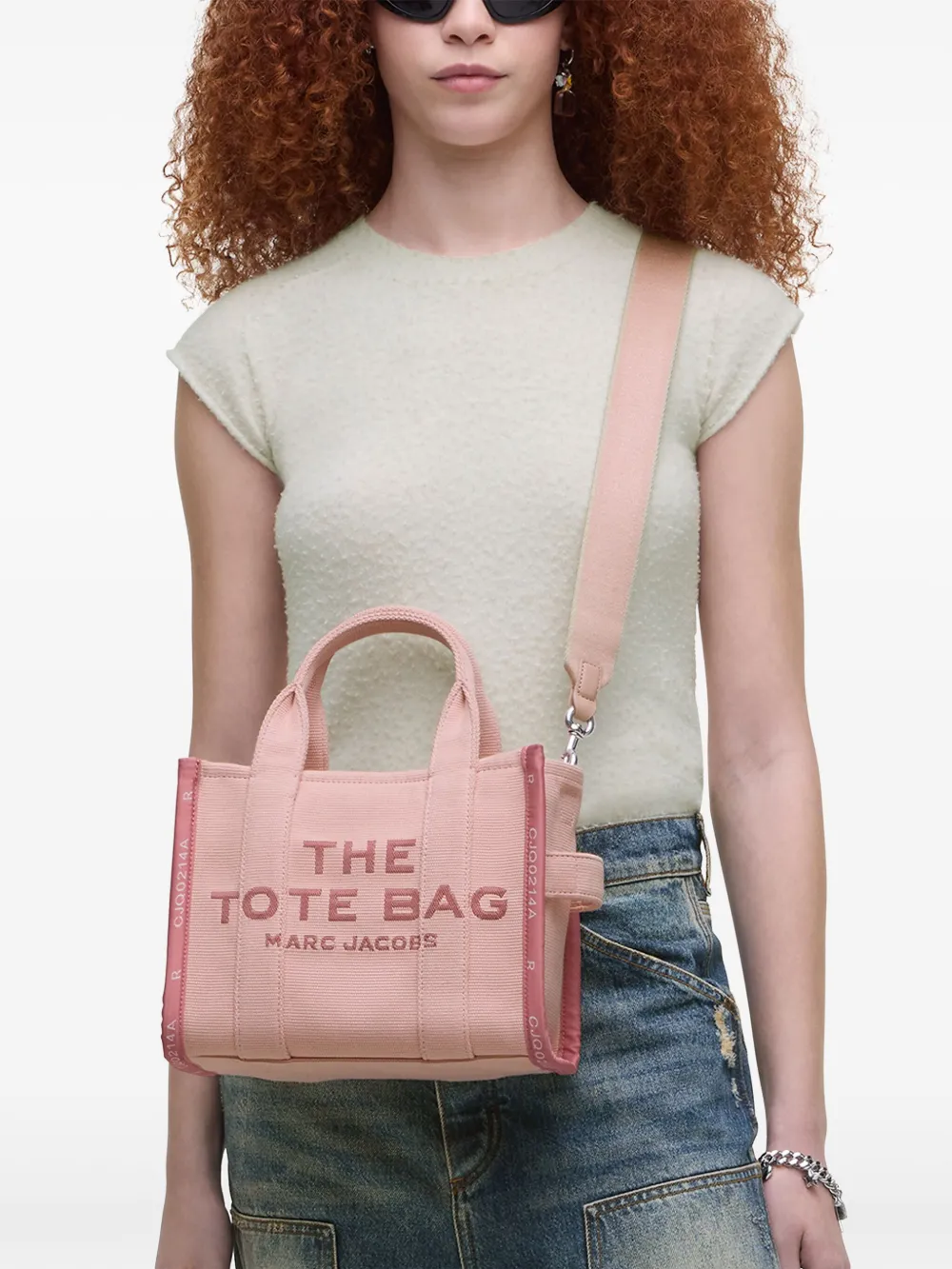 Pink bag, worn by a person, showing the bag's fit