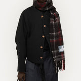 Black jacket worn by a person, showing the jacket fit