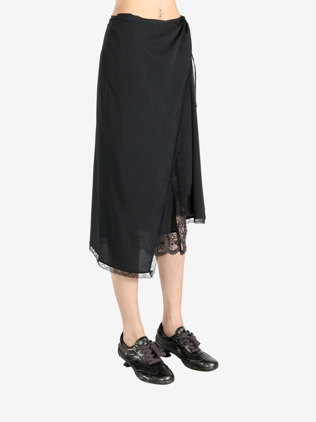 Black skirts worn by a person, showing the skirts fit