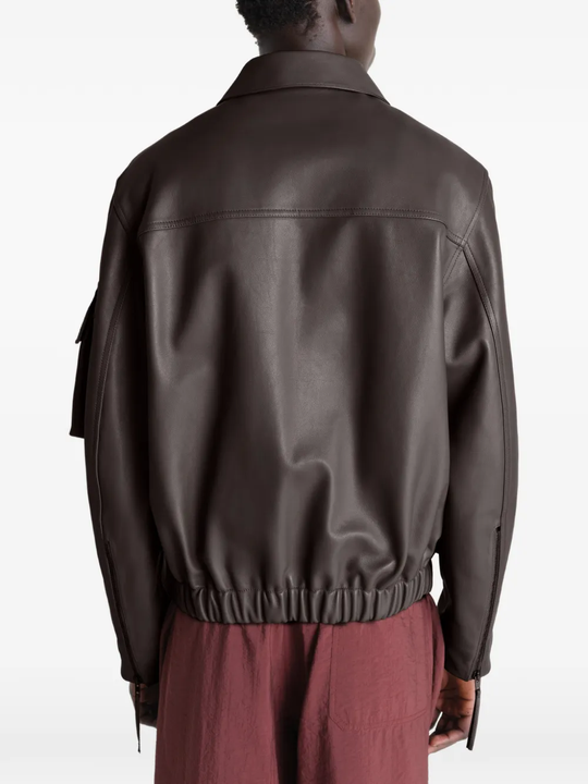 Brown coats worn by a person, showing the coats fit