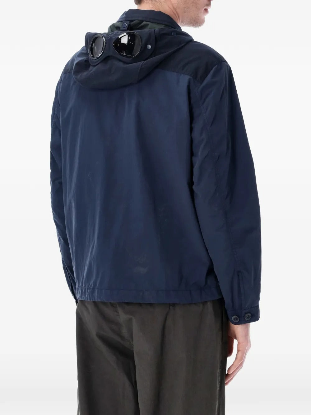 Navy jacket worn by a person, showing the jacket's fit