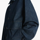 Close up of blue jacket, showing texture of the cotton fabric