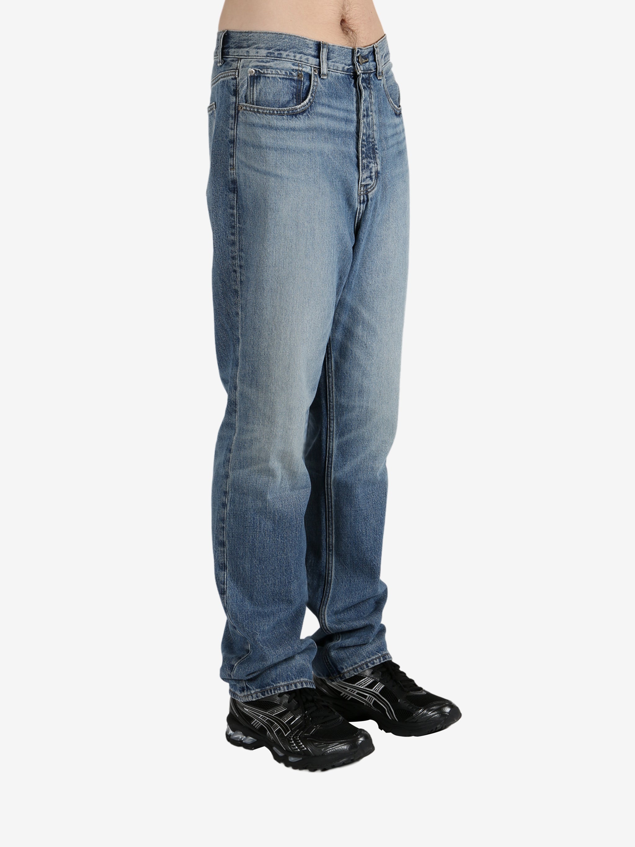 Blue jeans worn by a person, showing the jeans's fit